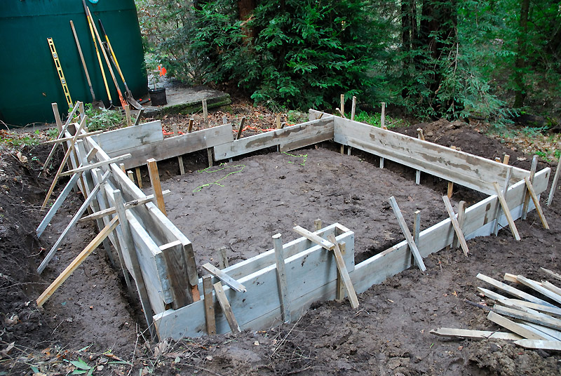 The shed foundation had to accommodate the grade on the slope
