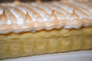 The piped border prevents the meringue from shrinking away from the crust while baking