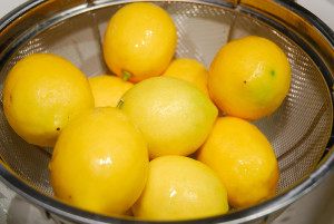 Drain the lemons and allow them to cool enough to be handled